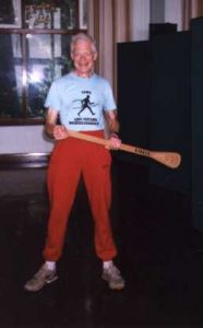 Tom Shepherd carries the ultimate 'cross 
Wales award at the presentation ceremony
following his encounter with a peat bog 
during the 1998 event.